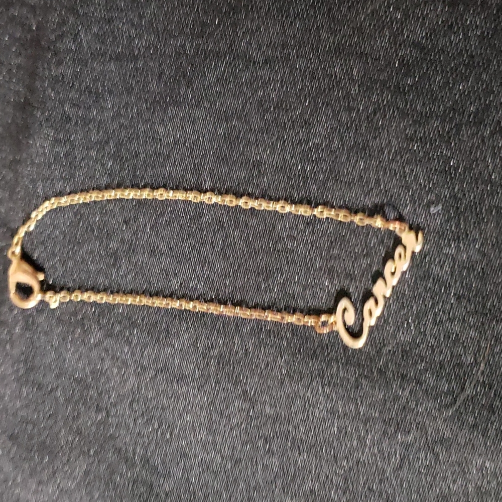 *Gold Tone Zodiac "Cancer" Bracelet.